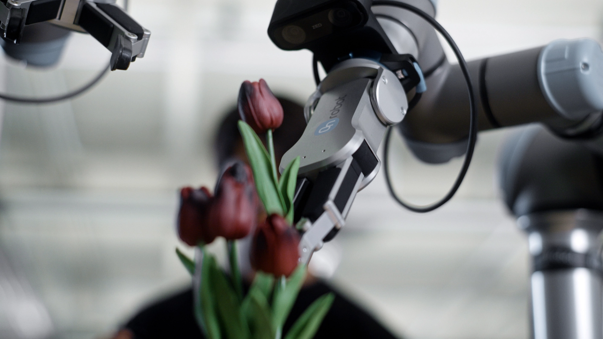A robotic arm holding flowers
